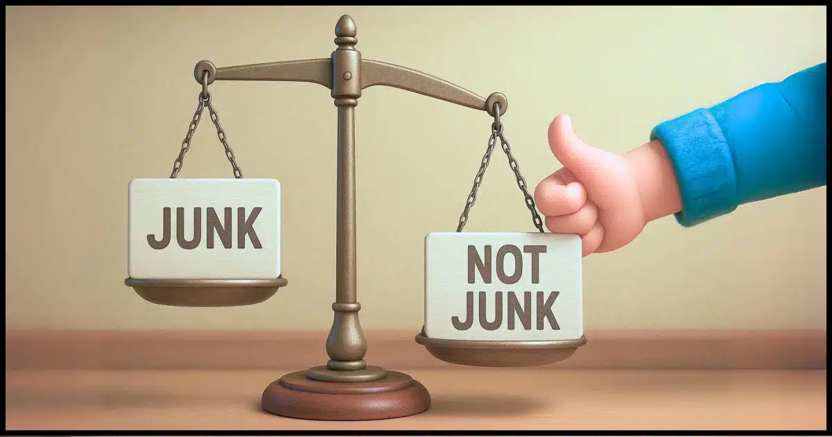 a balance scale with one side labeled "Junk", the other labeled "Not Junk" and an arm coming in from off camera putting a thumb on the Not Junk side to make it lower